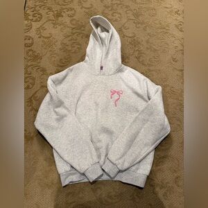 Edikted sweatshirt size small with bow on front and writing in back/ like new!